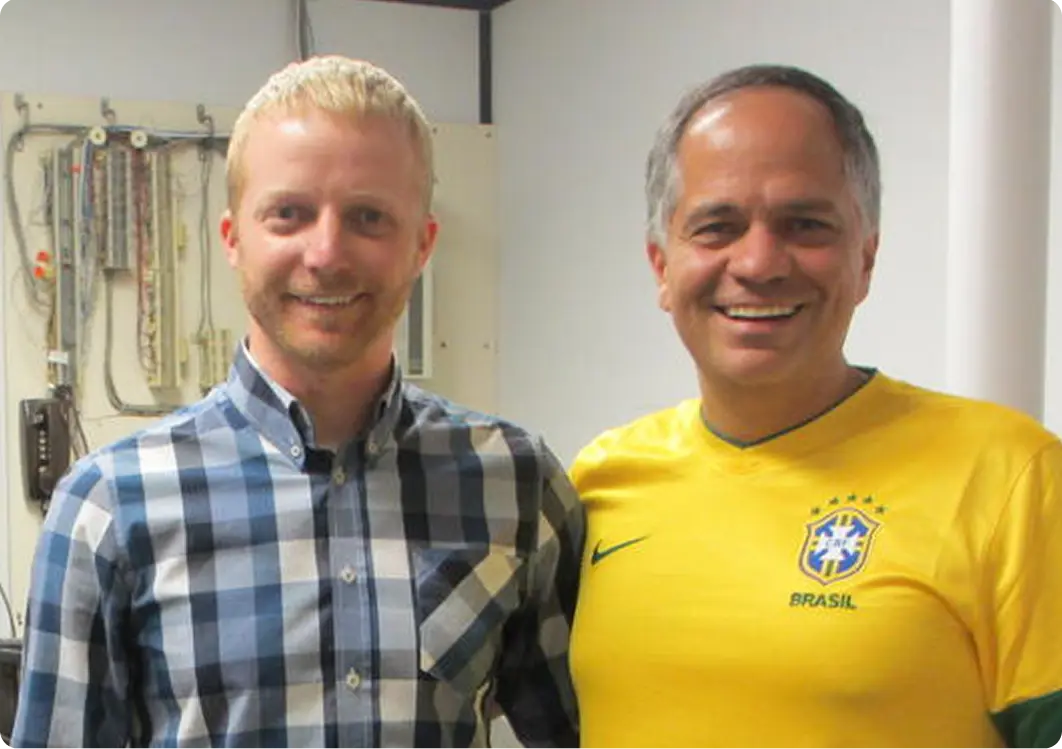 Two men smiling