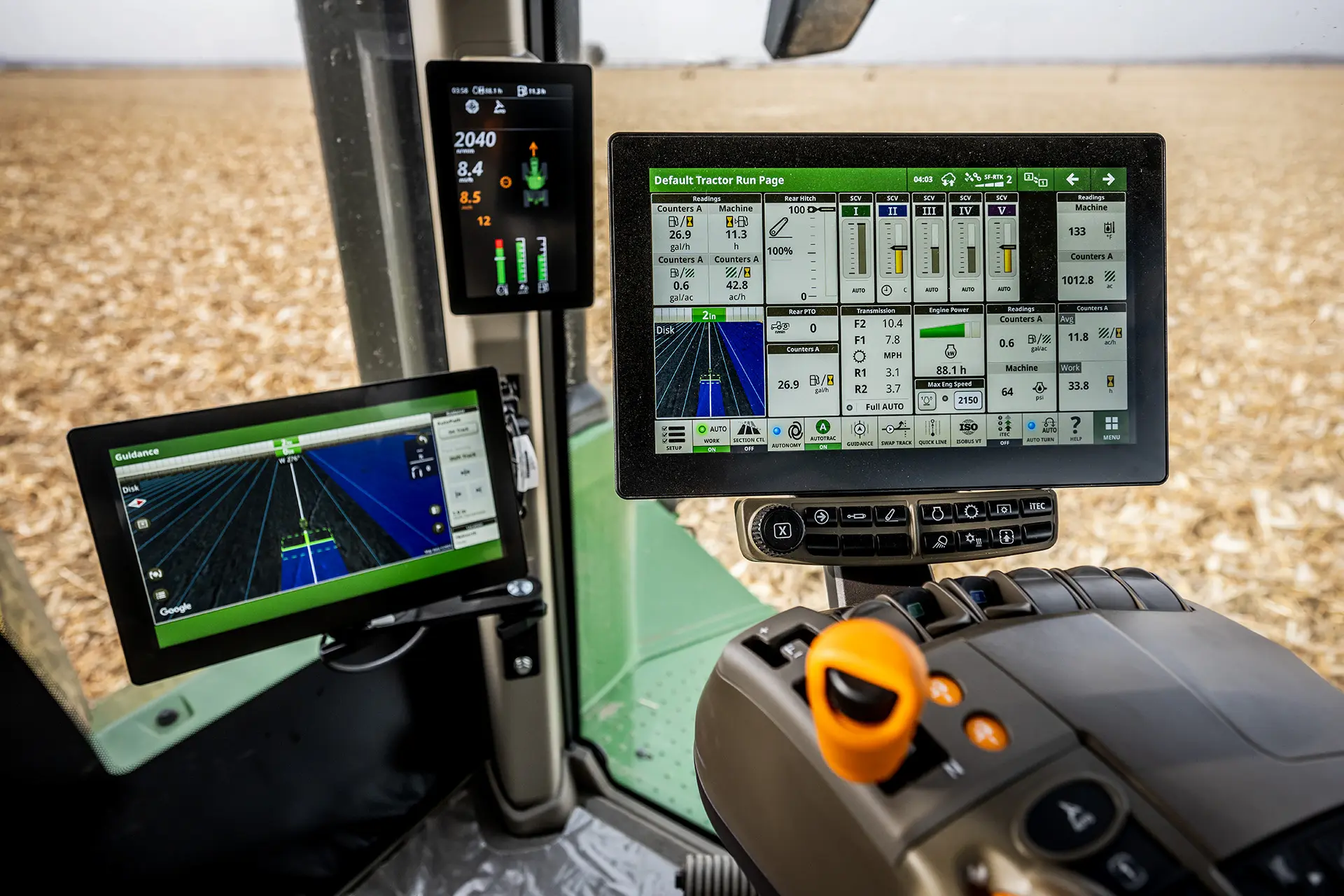 A view from within the cockpit of a farm vehicle retrofitted with Blue River Technology